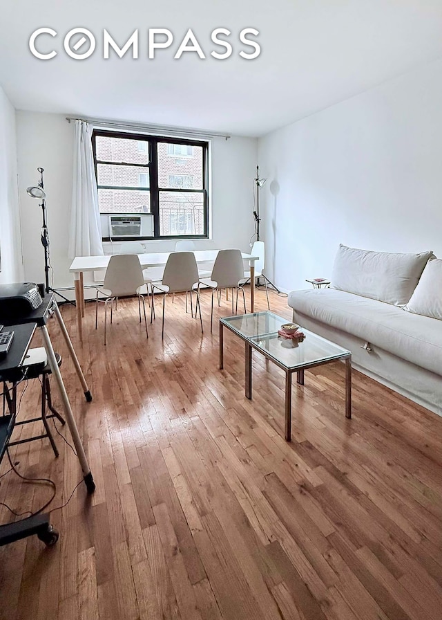 229 E 29th St Unit 5H, New York City, NY 10016 - living area with hardwood / wood-style floors and cooling unit