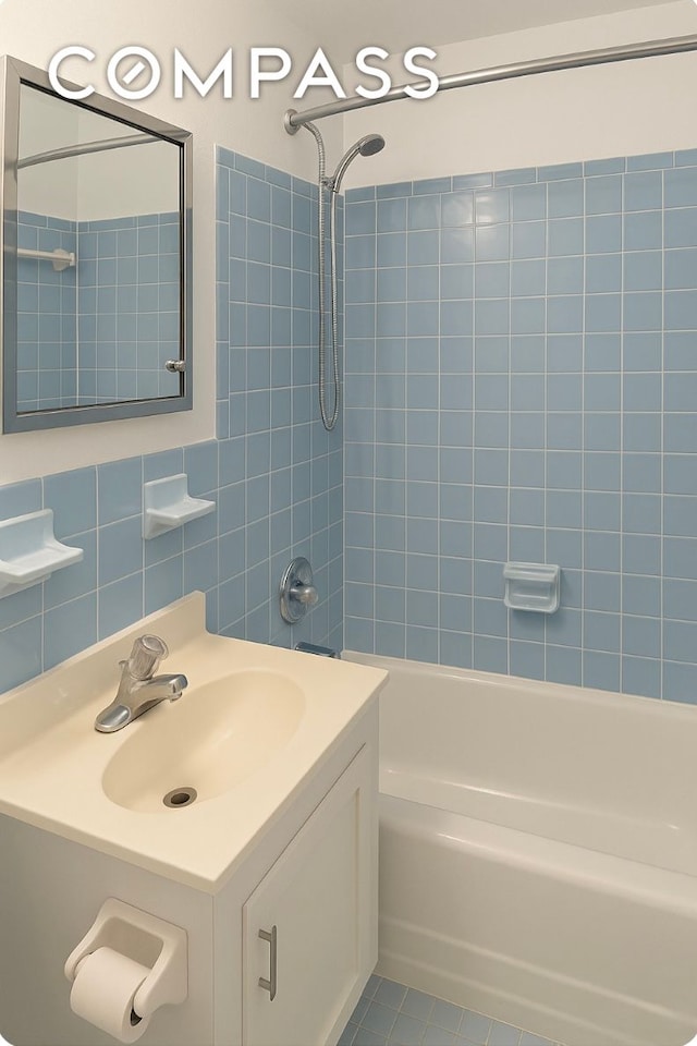 229 E 29th St Unit 5H, New York City, NY 10016 - full bath with tile walls, vanity, and shower / bathtub combination