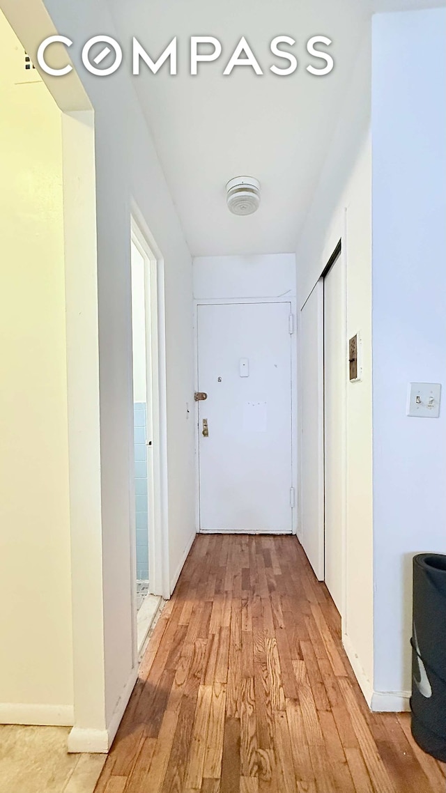 229 E 29th St Unit 5H, New York City, NY 10016 - hallway featuring light wood-type flooring and baseboards