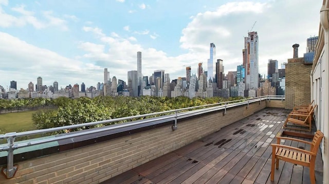 wooden deck with a city view