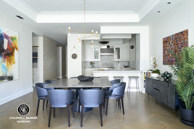 101 W 78th St Unit 5B, New York City, NY 10024 - dining room with a raised ceiling, crown molding, and baseboards