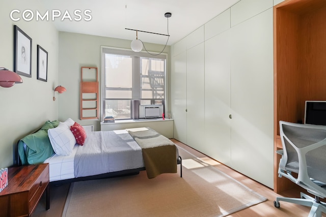265 Riverside Dr Unit 11F, New York City, NY 10025 - bedroom with wood finished floors, a closet, and cooling unit