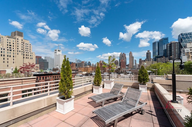 350 W 50th St Unit 6-R, New York City, NY 10019 - view of patio featuring a skyline view
