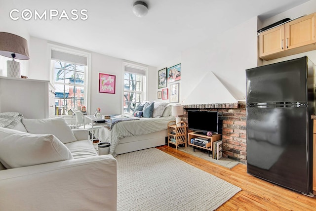 352 W 12th St Unit 5D, New York City, NY 10014 - living room featuring light wood-type flooring