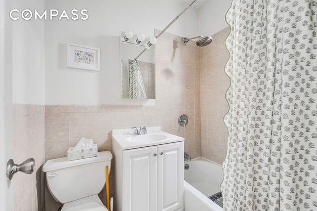 352 W 12th St Unit 5D, New York City, NY 10014 - bathroom with shower / bath combo, toilet, tile walls, and vanity