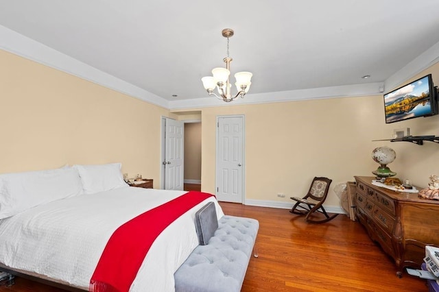 9437 Shore Rd Unit A1, New York City, NY 11209 - bedroom featuring a chandelier, wood finished floors, and baseboards