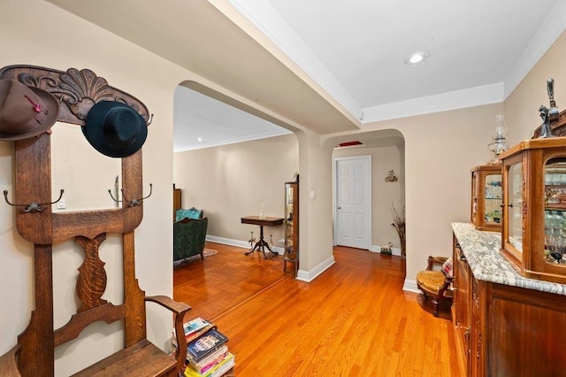 9437 Shore Rd Unit A1, New York City, NY 11209 - corridor featuring arched walkways, recessed lighting, baseboards, and light wood-style floors