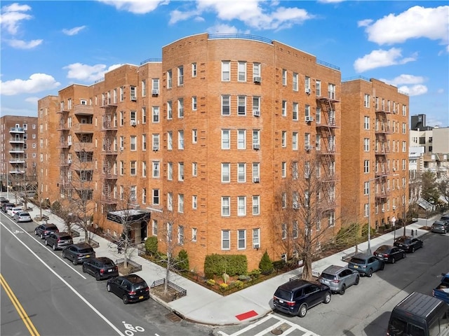 9437 Shore Rd Unit A1, New York City, NY 11209 - view of apartment building / complex featuring uncovered parking