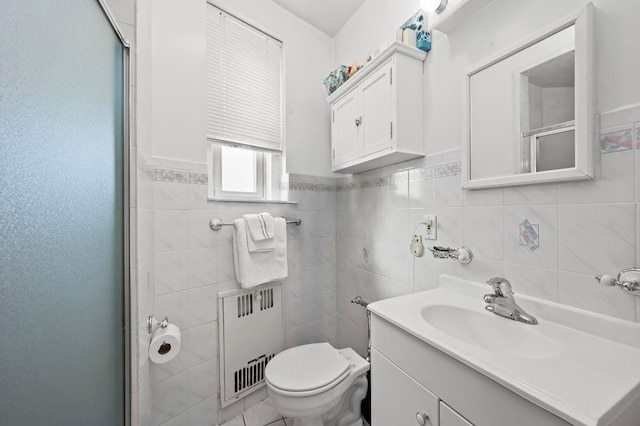 9437 Shore Rd Unit A1, New York City, NY 11209 - bathroom featuring radiator, vanity, tile walls, toilet, and a shower stall
