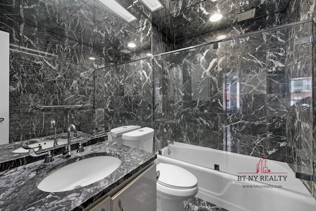 216 E 47th St Unit 4-A, New York City, NY 10017 - bathroom with vanity, shower / bath combination, toilet, and tile walls