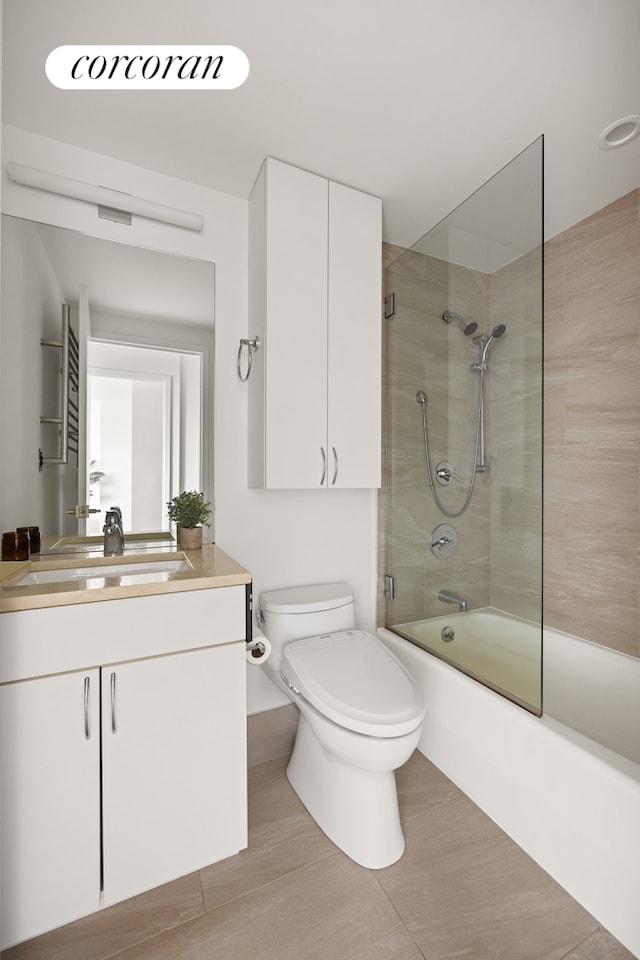 full bathroom featuring toilet, combined bath / shower with glass door, and vanity