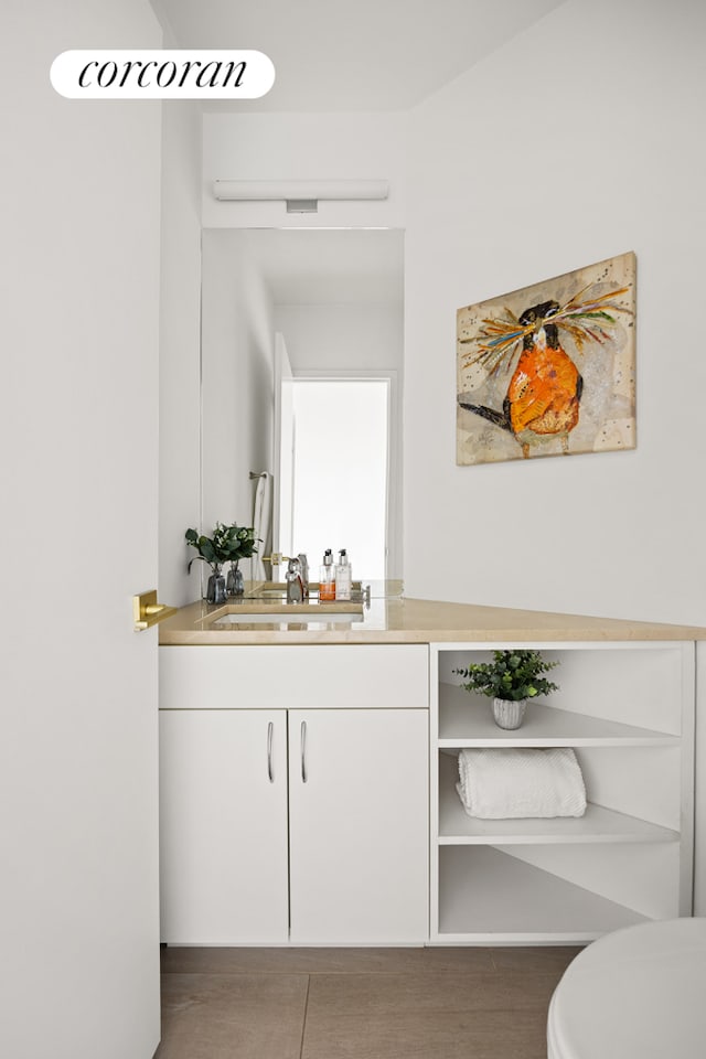 bar featuring a sink and wood finished floors