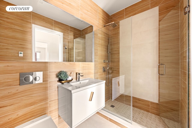 1122 Lafayette Ave Unit 3A, New York City, NY 11221 - full bathroom with a stall shower, tile walls, and vanity
