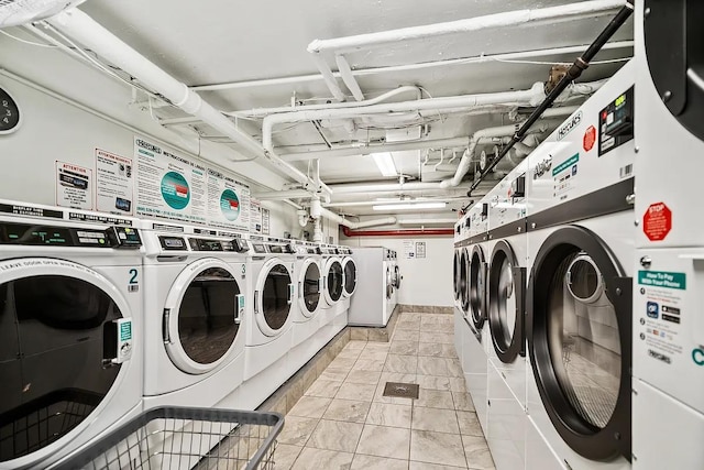 shared laundry room with washer and clothes dryer