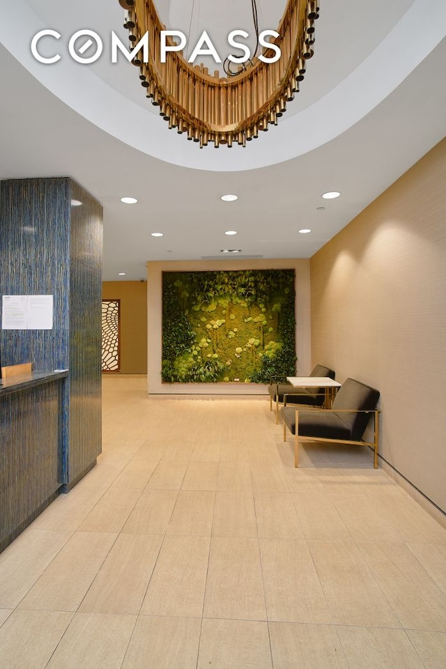 lobby with a high ceiling and recessed lighting