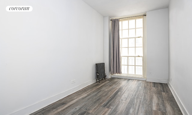508 E 78th St Unit 2M, New York City, NY 10075 - unfurnished room featuring radiator heating unit and dark wood finished floors