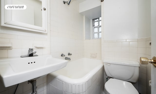508 E 78th St Unit 2M, New York City, NY 10075 - bathroom with tile walls and a tub