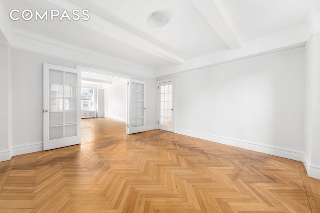 spare room with french doors, baseboards, and beam ceiling
