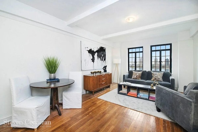 5 Tudor City Pl Unit 931, New York City, NY 10017 - living area featuring beamed ceiling and wood finished floors