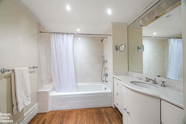 full bathroom with crown molding, shower / bathtub combination with curtain, vanity, recessed lighting, and wood finished floors