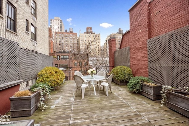 exterior space featuring a view of city and outdoor dining area