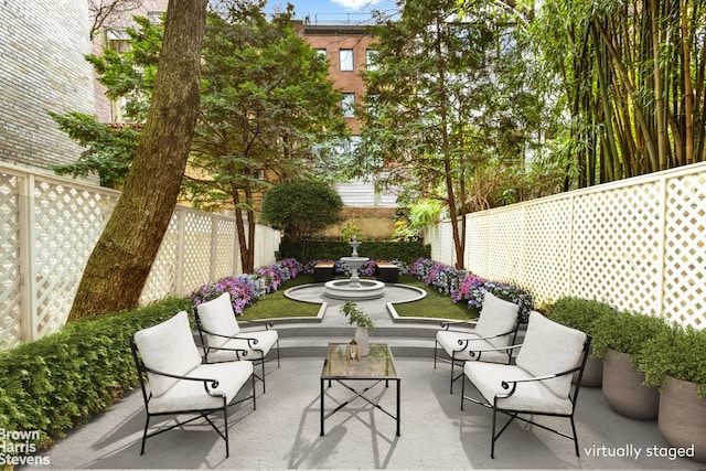 view of patio / terrace featuring outdoor lounge area and a fenced backyard