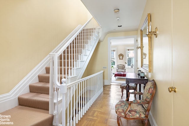 staircase featuring baseboards