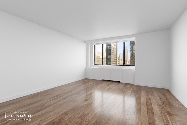 30 W 61st St Unit 24C, New York City, NY 10023 - empty room featuring wood finished floors and baseboards