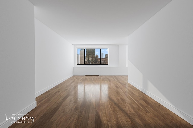 30 W 61st St Unit 24C, New York City, NY 10023 - unfurnished room featuring baseboards and wood finished floors