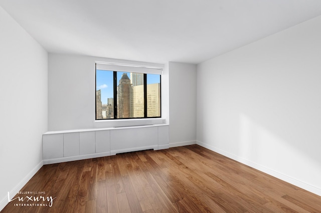 30 W 61st St Unit 24C, New York City, NY 10023 - empty room featuring wood finished floors and baseboards