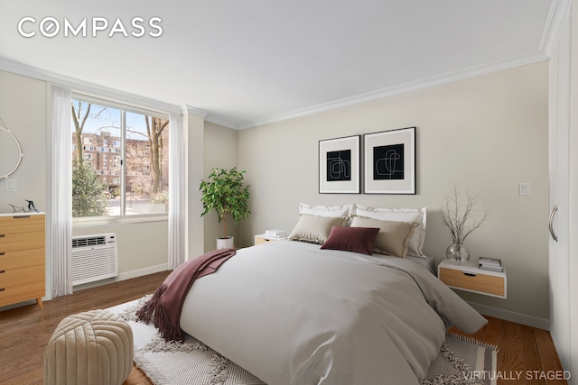 551 Main St Unit 208, New York City, NY 10044 - bedroom featuring ornamental molding, baseboards, an AC wall unit, and wood finished floors
