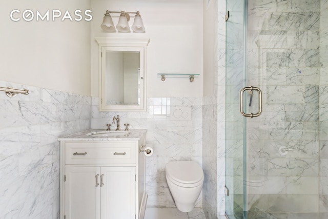 551 Main St Unit 208, New York City, NY 10044 - bathroom featuring tile walls, a marble finish shower, vanity, toilet, and wainscoting