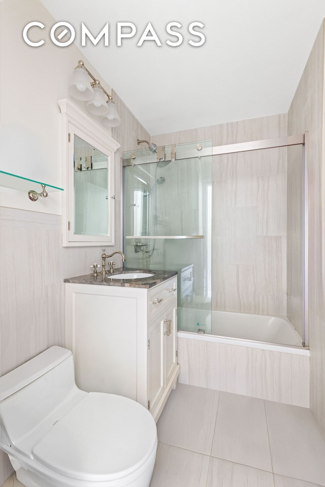 551 Main St Unit 208, New York City, NY 10044 - bathroom with toilet, tiled shower / bath, vanity, and tile patterned flooring