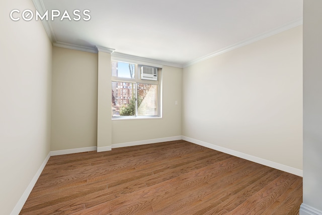 551 Main St Unit 208, New York City, NY 10044 - unfurnished room with crown molding, wood finished floors, an AC wall unit, and baseboards
