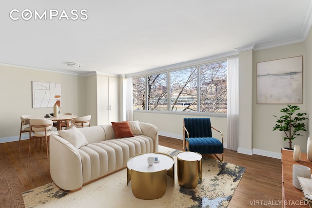 551 Main St Unit 208, New York City, NY 10044 - living area featuring crown molding, baseboards, and wood finished floors