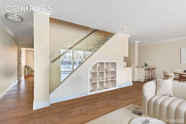551 Main St Unit 208, New York City, NY 10044 - living room with wood finished floors, crown molding, and baseboards