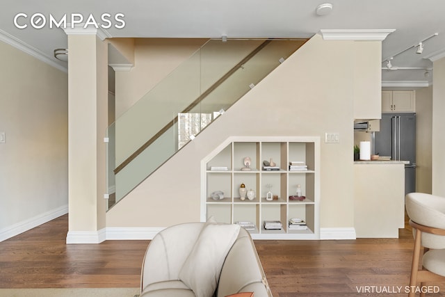551 Main St Unit 208, New York City, NY 10044 - living area with crown molding, wood finished floors, stairway, and track lighting