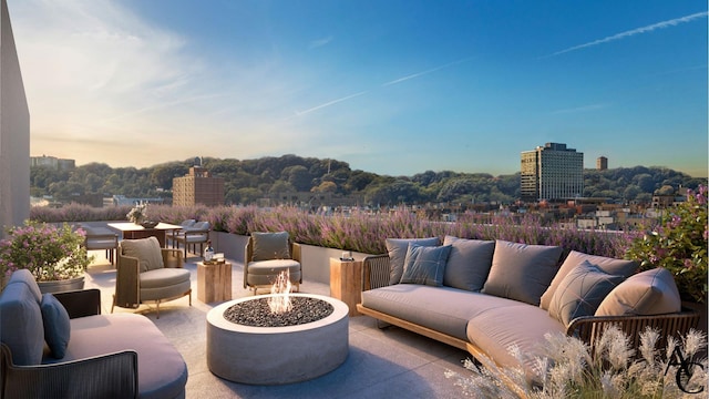 patio terrace at dusk featuring an outdoor living space with a fire pit
