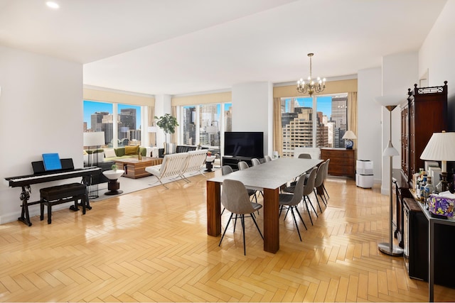 dining area with a chandelier and baseboards