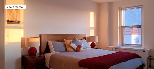 310 Riverside Dr Unit 2009, New York City, NY 10025 - bedroom with radiator heating unit and multiple windows