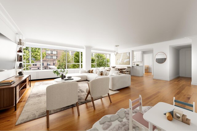 200 E 66th St Unit A301, New York City, NY 10065 - living area with crown molding and light wood-style flooring