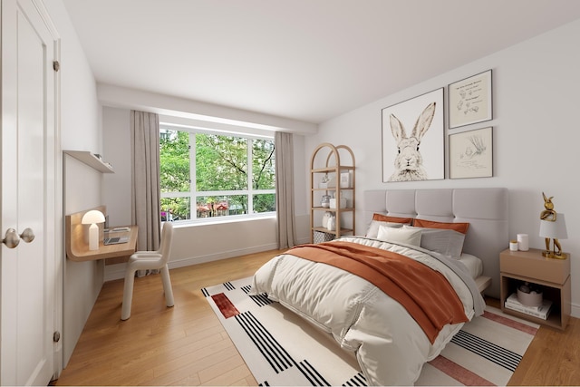bedroom featuring light wood-style flooring and baseboards