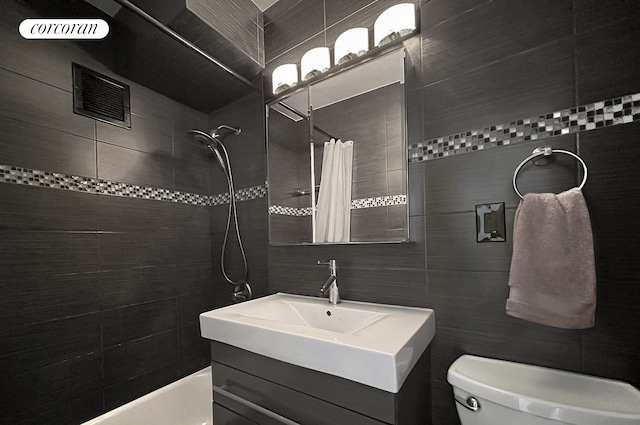 153 E 57th St Unit 11L, New York City, NY 10022 - full bath with tile walls, a tile shower, and vanity