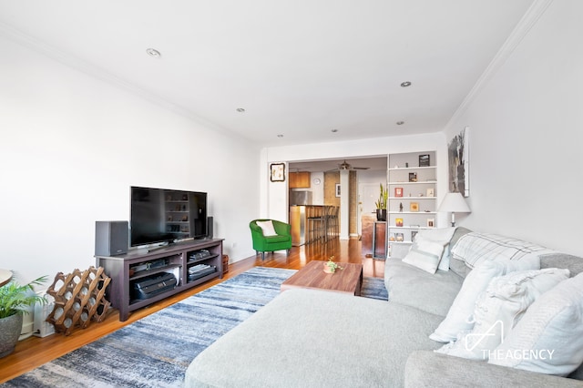 153 Bennett Ave Unit 3G, New York City, NY 10040 - living area featuring crown molding, wood finished floors, and a ceiling fan
