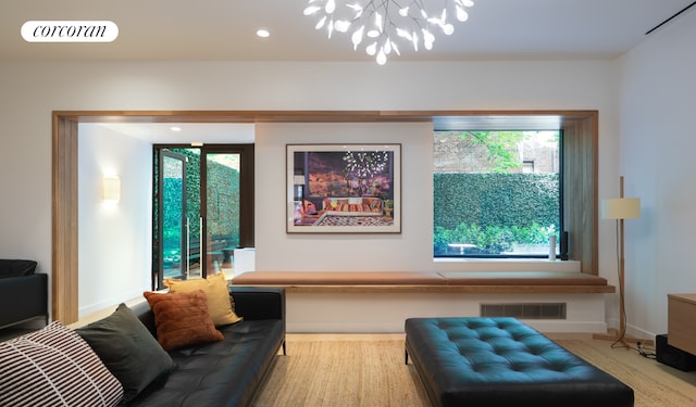 234 E 46th St Unit 804, New York City, NY 10017 - living room with a chandelier, baseboards, and recessed lighting