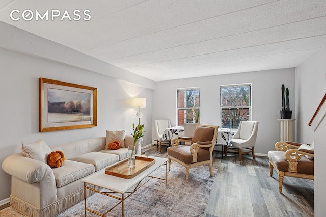 living room with wood finished floors and baseboards