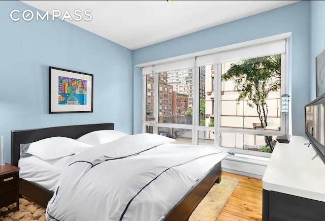 454 W 54th St Unit 3D, New York City, NY 10019 - bedroom featuring light wood-style flooring