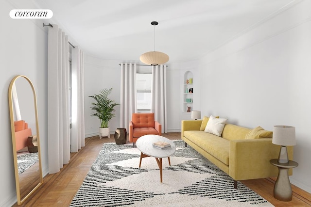 living area featuring baseboards and built in shelves