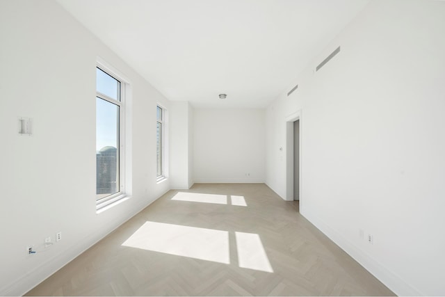 empty room featuring baseboards