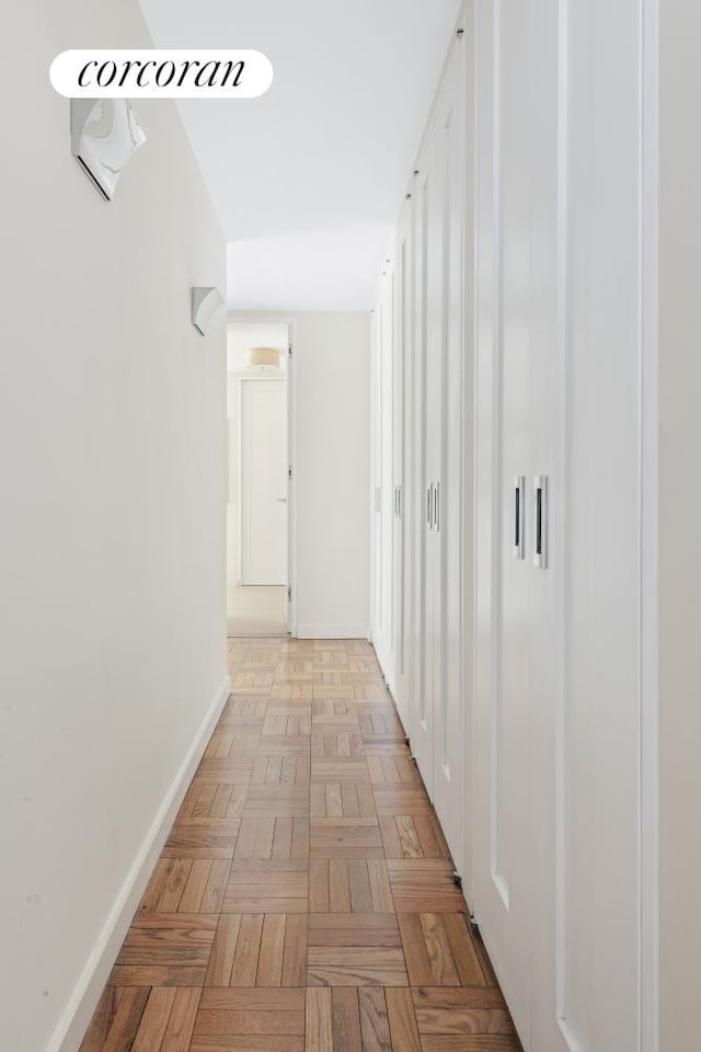 hallway featuring baseboards